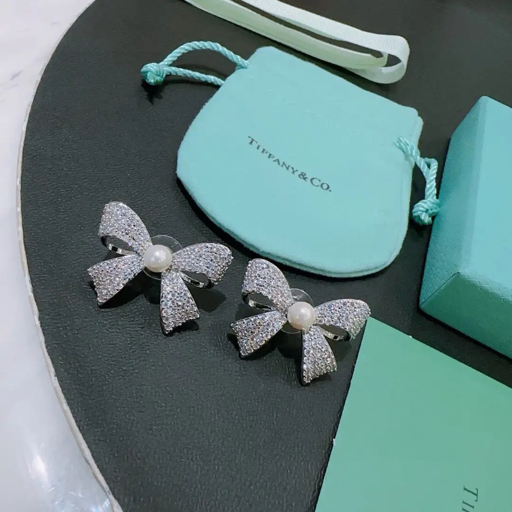 Tiffany & Co. diamond bow earrings with small pearls